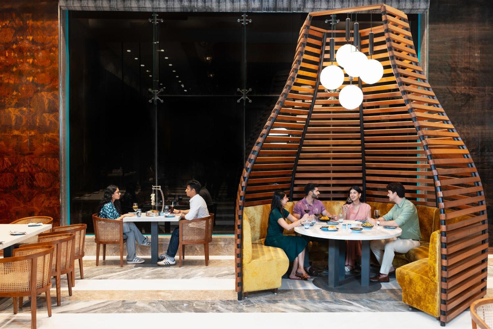 Radisson Blu Plaza Resort & Convention Centre Karjat Exterior photo The interior of the restaurant