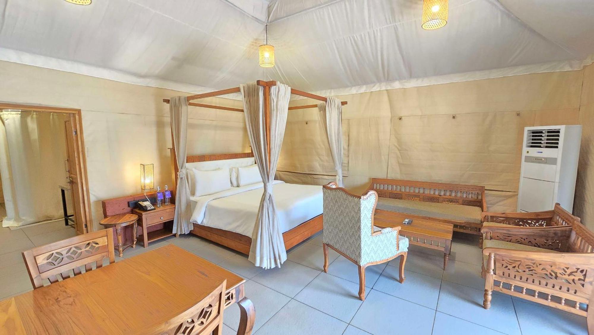 Radisson Blu Plaza Resort & Convention Centre Karjat Exterior photo A bedroom in a tent at the resort